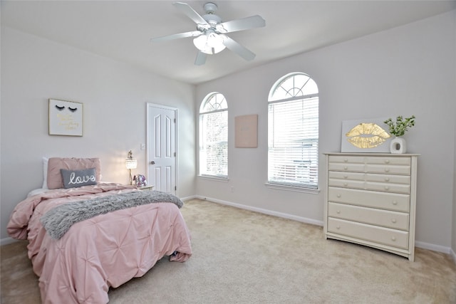 bedroom with carpet floors, a ceiling fan, and baseboards