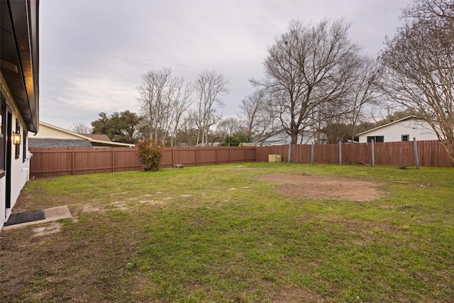 view of yard featuring a fenced backyard