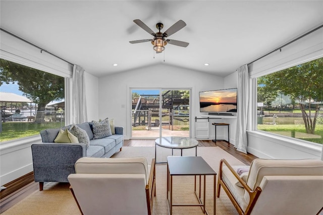 living room featuring ceiling fan, recessed lighting, wood finished floors, baseboards, and vaulted ceiling