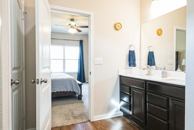 4337 Buffalo Ford Rd, Georgetown, TX 78628 - full bath with wood finished floors, double vanity, ensuite bath, ceiling fan, and baseboards