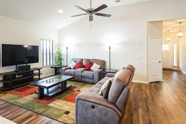 4337 Buffalo Ford Rd, Georgetown, TX 78628 - living area with wood finished floors, plenty of natural light, baseboards, and high vaulted ceiling