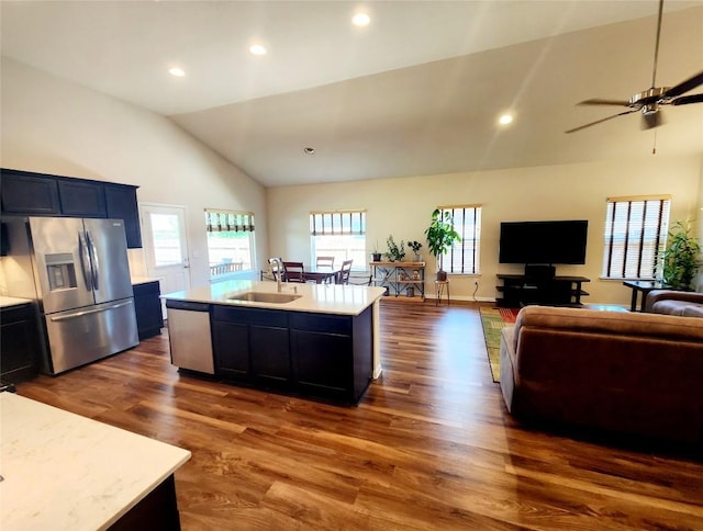 4337 Buffalo Ford Rd, Georgetown, TX 78628 - kitchen with stainless steel appliances, a sink, light countertops, open floor plan, and dark wood-type flooring