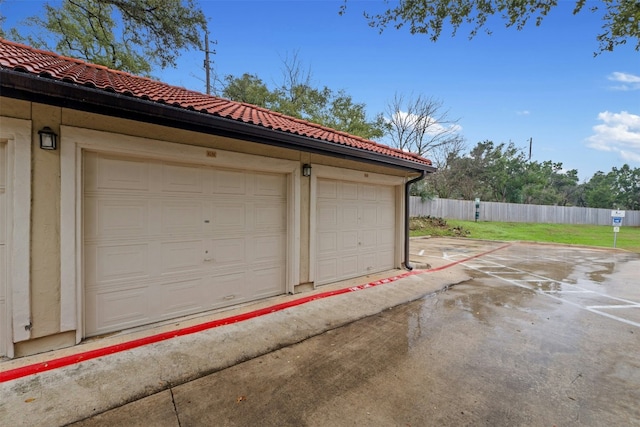 garage with fence