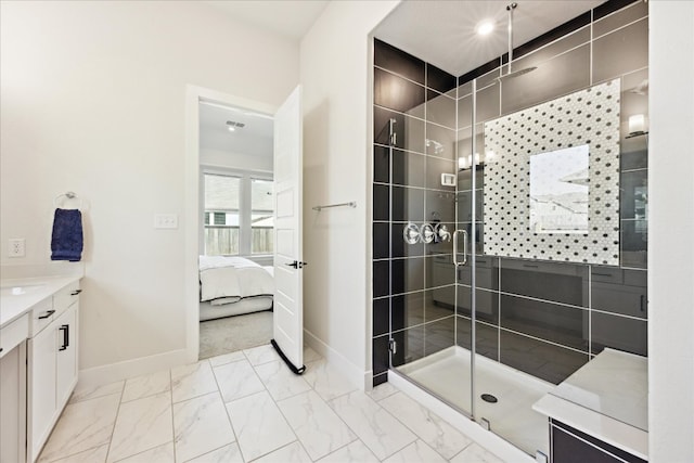 ensuite bathroom with marble finish floor, a shower stall, baseboards, and connected bathroom