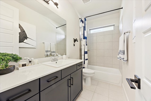 full bathroom featuring toilet, tile patterned floors, visible vents, vanity, and shower / tub combo with curtain