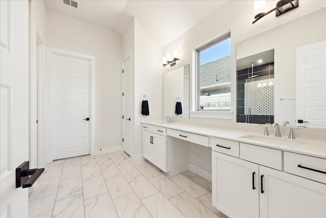 bathroom featuring double vanity, marble finish floor, visible vents, and a sink