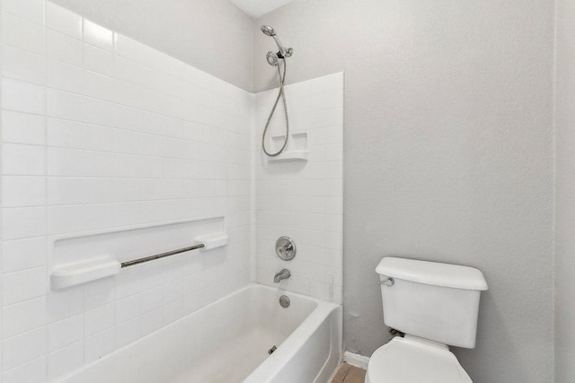 bathroom with shower / washtub combination and toilet