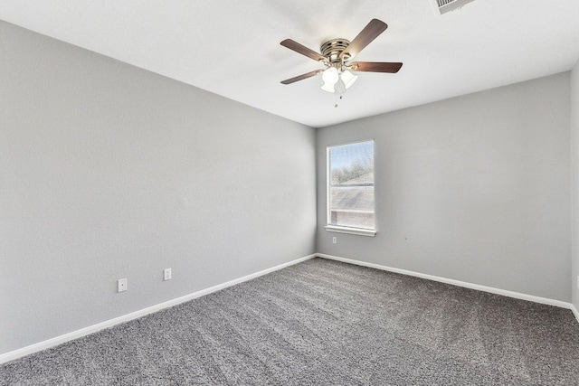 spare room featuring carpet floors, ceiling fan, and baseboards