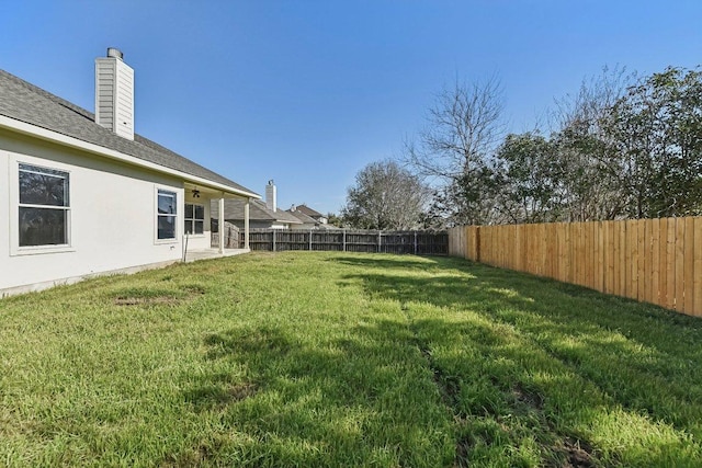 view of yard featuring a fenced backyard