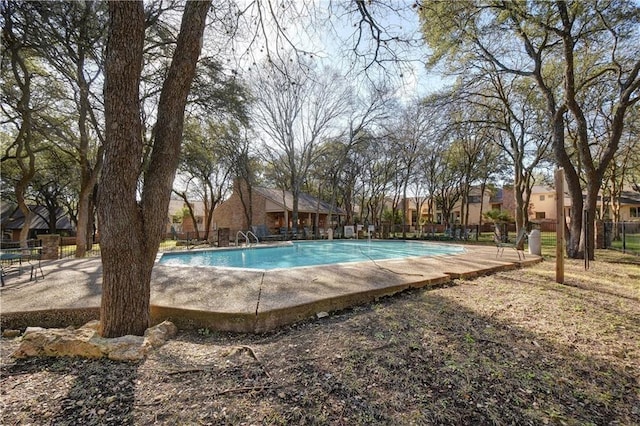 pool featuring a residential view and fence