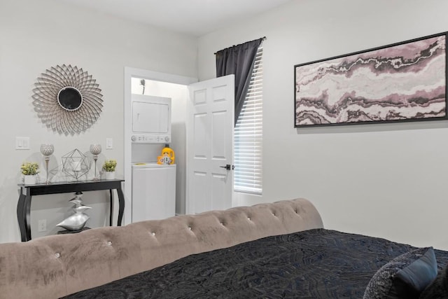 bedroom with stacked washer and clothes dryer