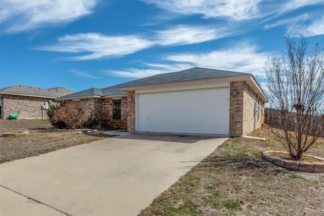 ranch-style home featuring concrete driveway, brick siding, and an attached garage