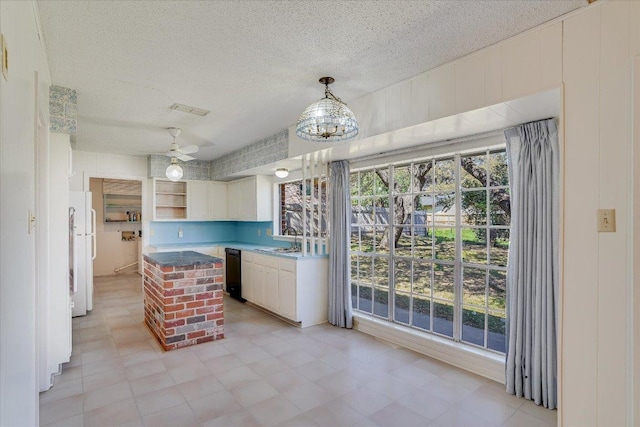 kitchen with open shelves, visible vents, white cabinetry, a sink, and dishwasher