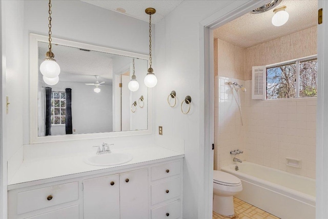 bathroom featuring bathtub / shower combination, plenty of natural light, a textured ceiling, and toilet