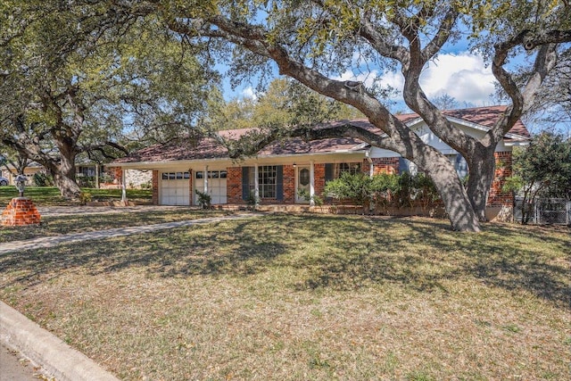 ranch-style home with brick siding, an attached garage, and a front lawn