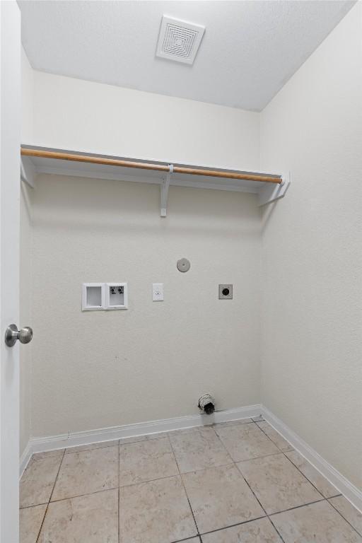 laundry room featuring hookup for a washing machine, hookup for an electric dryer, laundry area, visible vents, and baseboards