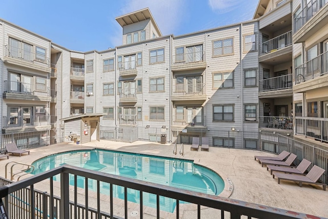 community pool featuring a patio area