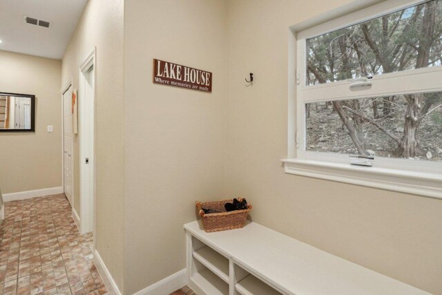 mudroom with visible vents and baseboards