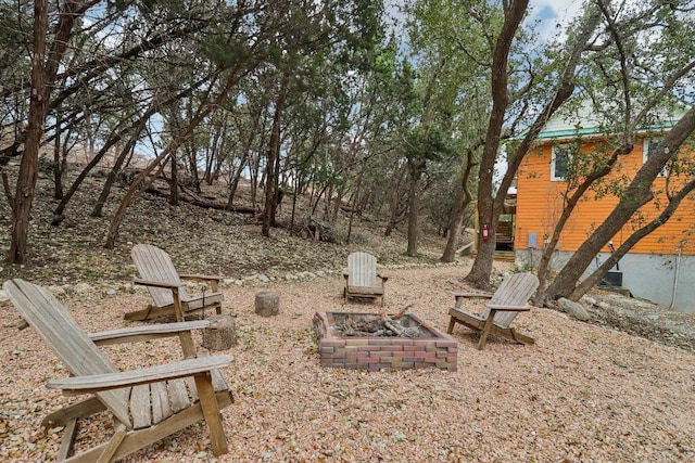 view of yard with an outdoor fire pit