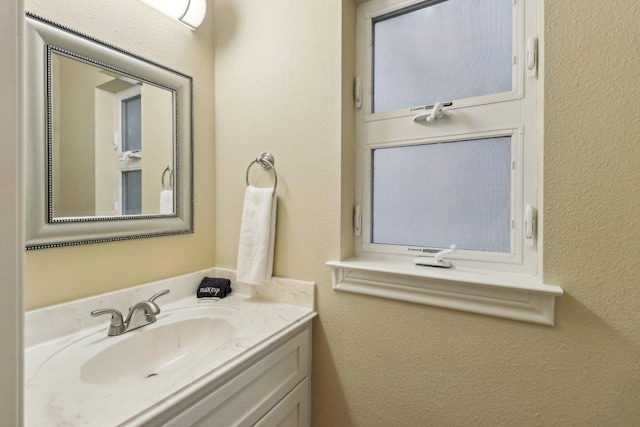 1024 Summit Blf, Canyon Lake, TX 78133 - bathroom featuring vanity and a textured wall