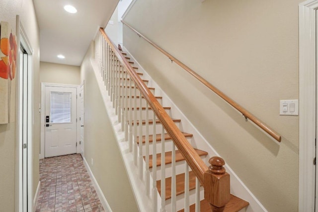 staircase featuring recessed lighting and baseboards