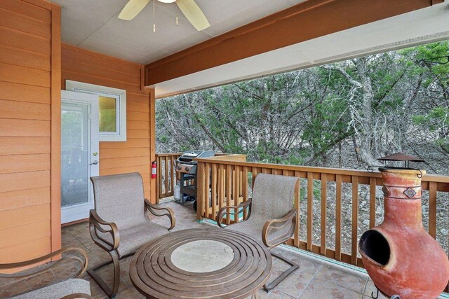 exterior space with a ceiling fan