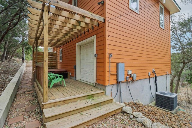 exterior space with a deck and central AC