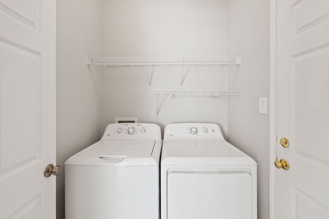 laundry room featuring laundry area and separate washer and dryer