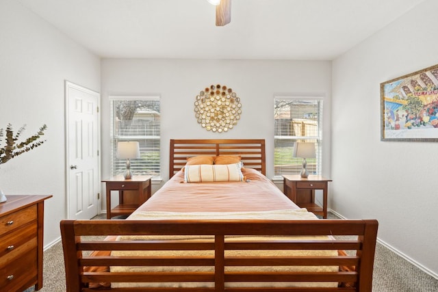 bedroom featuring a ceiling fan, baseboards, and carpet flooring