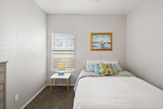 carpeted bedroom with baseboards