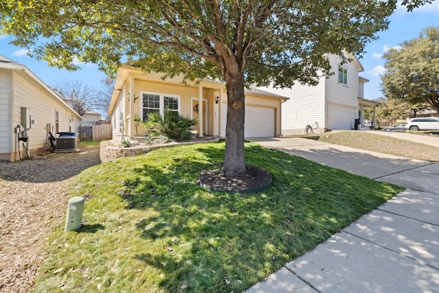 view of front of home featuring a front yard, driveway, fence, and central air condition unit