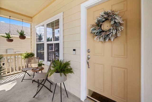 doorway to property with covered porch