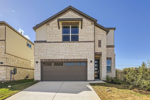 view of front of property with a garage, stone siding, and driveway