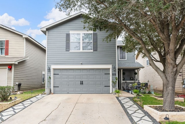 traditional-style house featuring concrete driveway and an attached garage