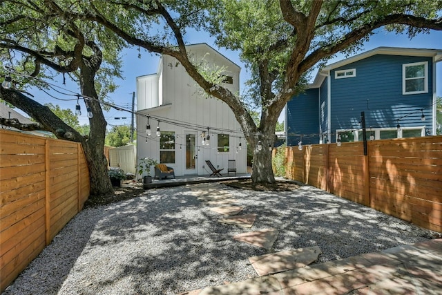 view of front of property with a patio and a fenced backyard