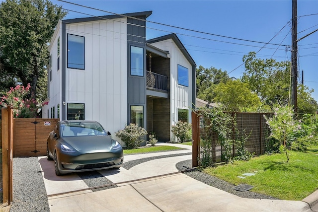 view of front of property featuring fence and board and batten siding