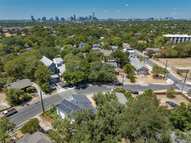 birds eye view of property with a view of city