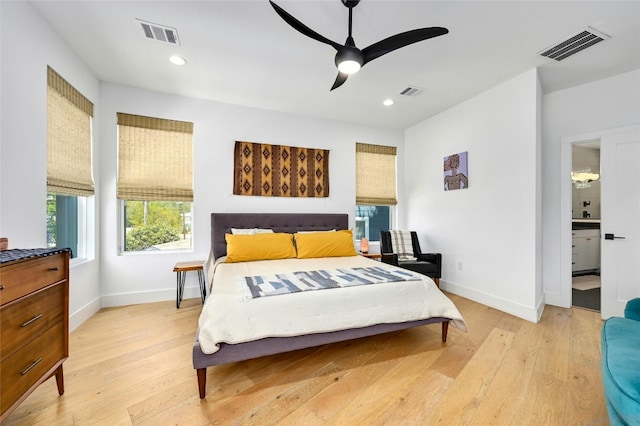 bedroom with visible vents and light wood-style floors