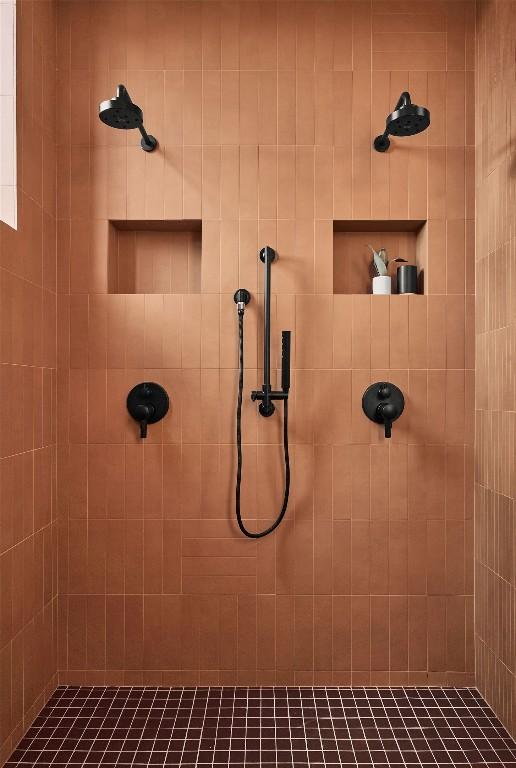 full bath featuring tiled shower