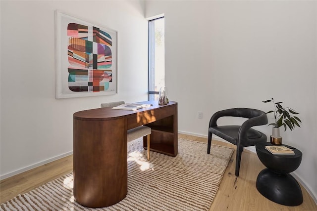 office area featuring wood finished floors and baseboards