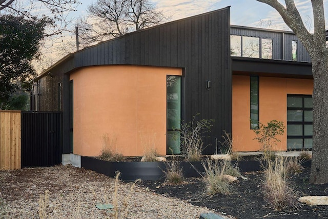 view of property exterior featuring fence