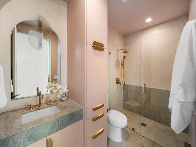 full bathroom with vanity, a shower stall, toilet, and recessed lighting