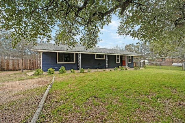 single story home featuring fence and a front yard