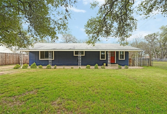 ranch-style house with a front lawn and fence