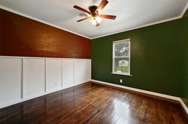 spare room featuring hardwood / wood-style flooring, ceiling fan, ornamental molding, and baseboards