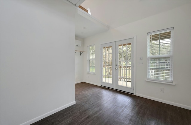 entryway featuring french doors, baseboards, an AC wall unit, and dark wood-style flooring