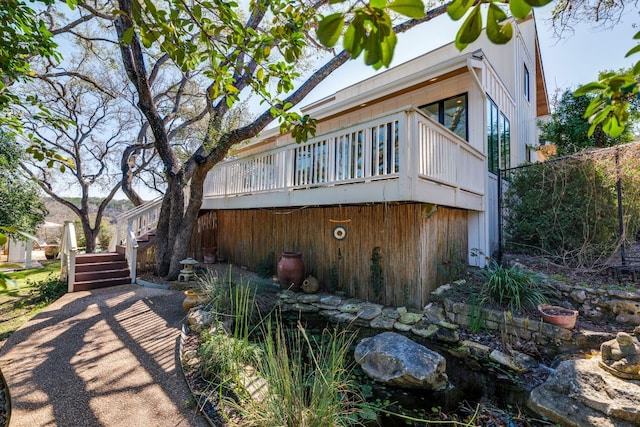 view of home's exterior featuring a wooden deck