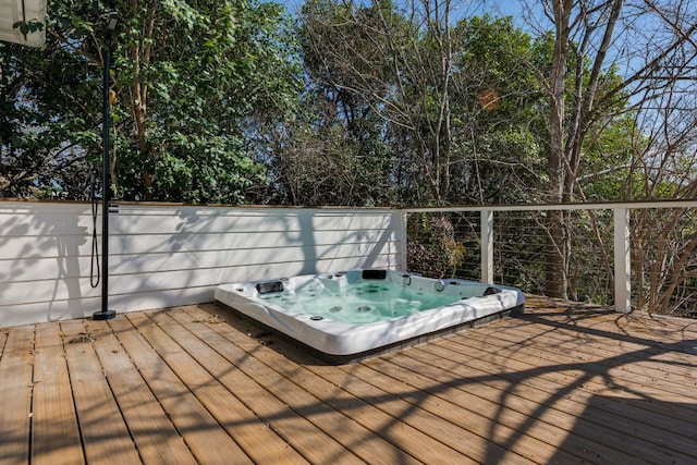 wooden deck with hot tub deck surround