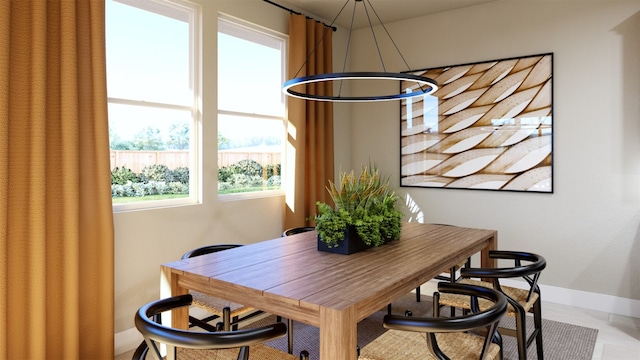 dining area featuring baseboards