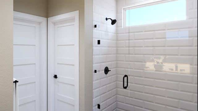 bathroom with a shower stall